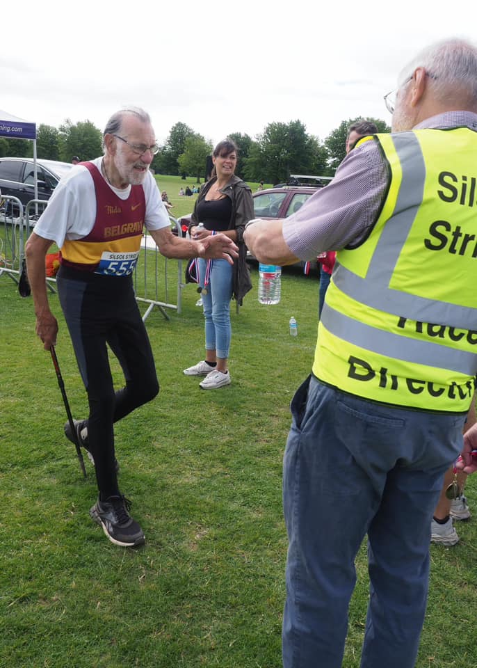 Runner collecting their 11th medal